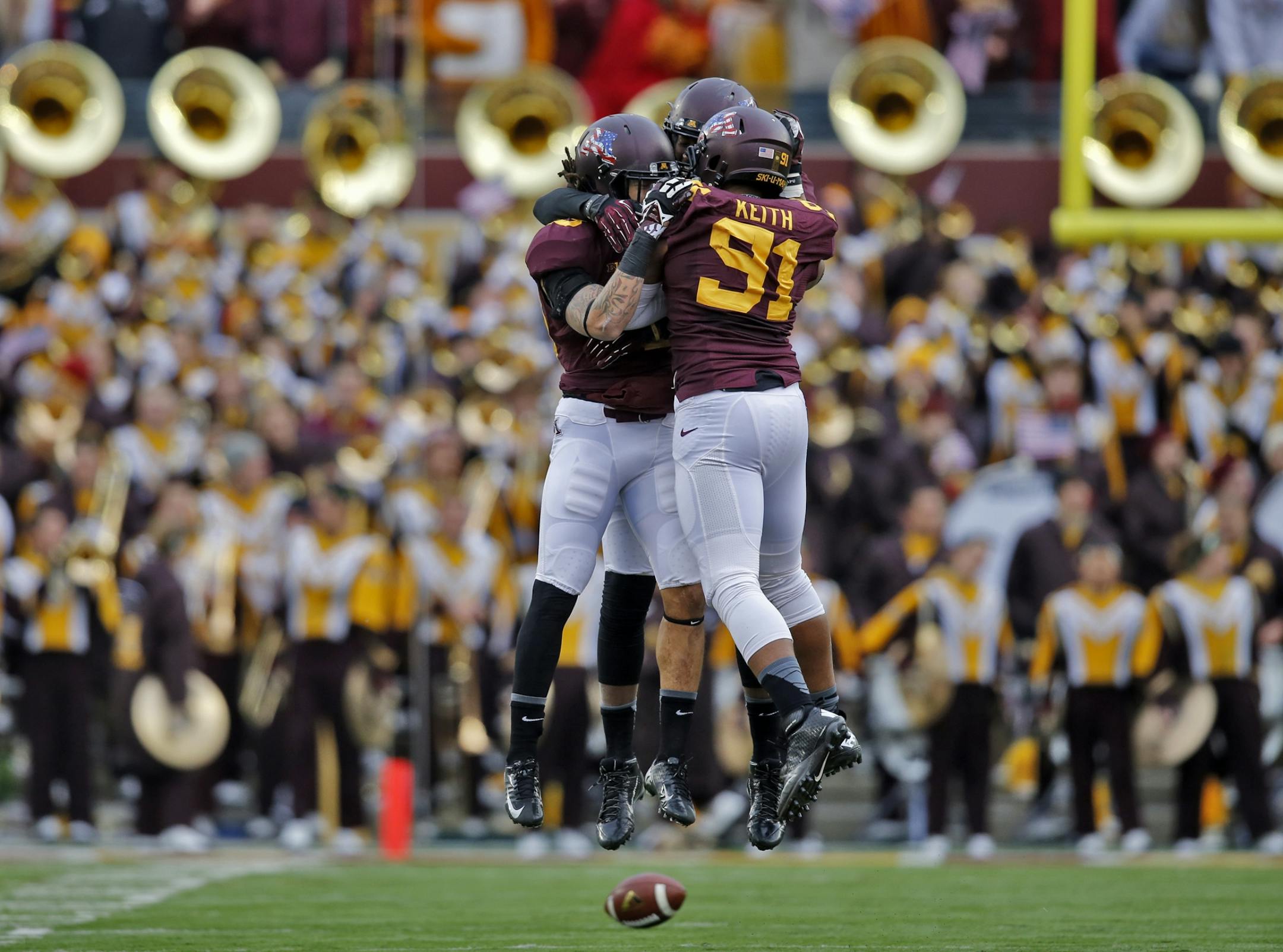 Minnesota defensive players Alex Keith (91), Derrick Wells and Thieren Cockran celebrated in front of the Minnesota band after stopping Penn State on a fourth down play late in the game earlier this season.