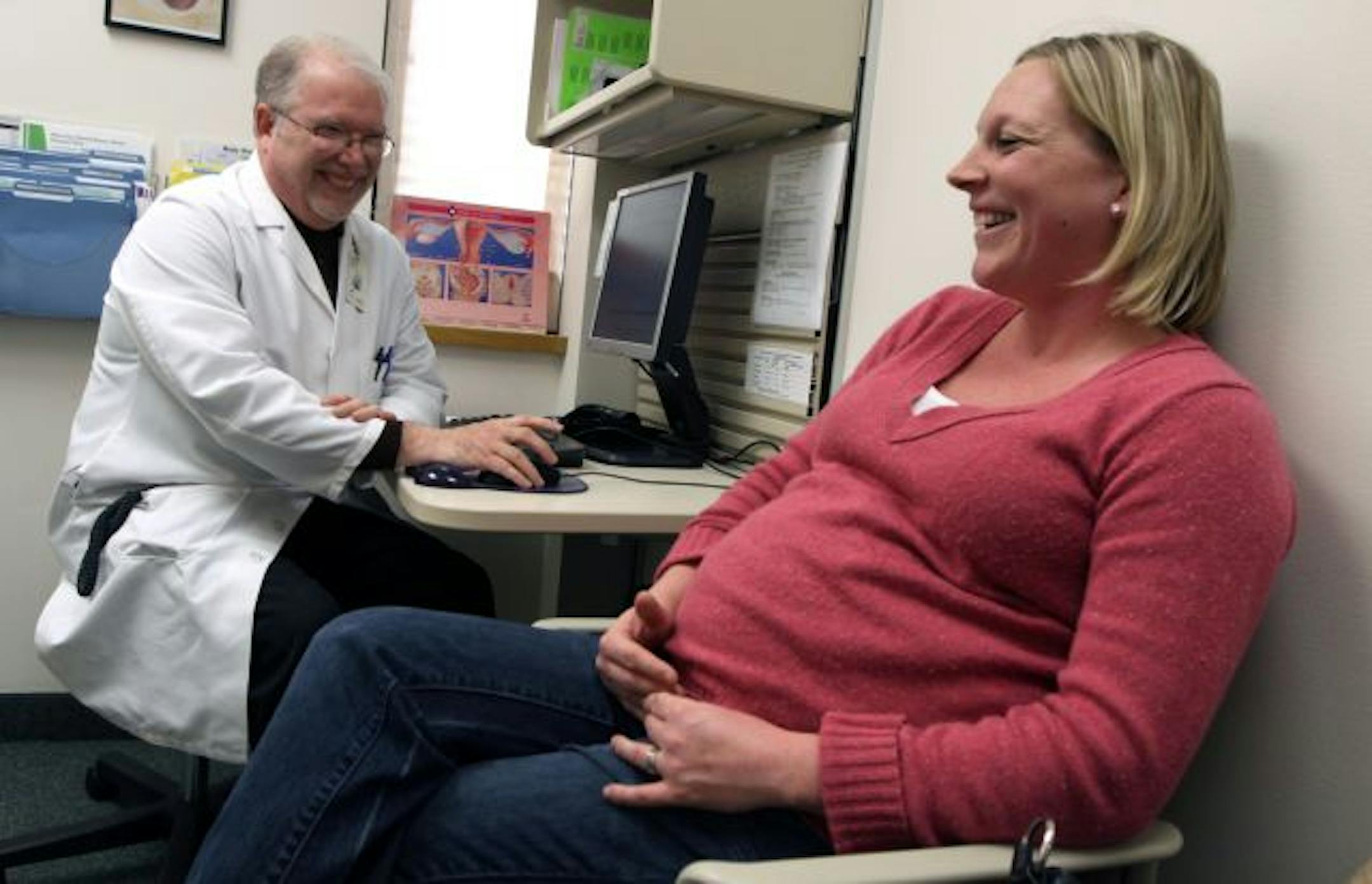 Dr. Michael Spence spoke with Gina Jacobsen of West St. Paul, 38 weeks pregnant, at the Eagan Allina Medical Parkview OB/GYN office.