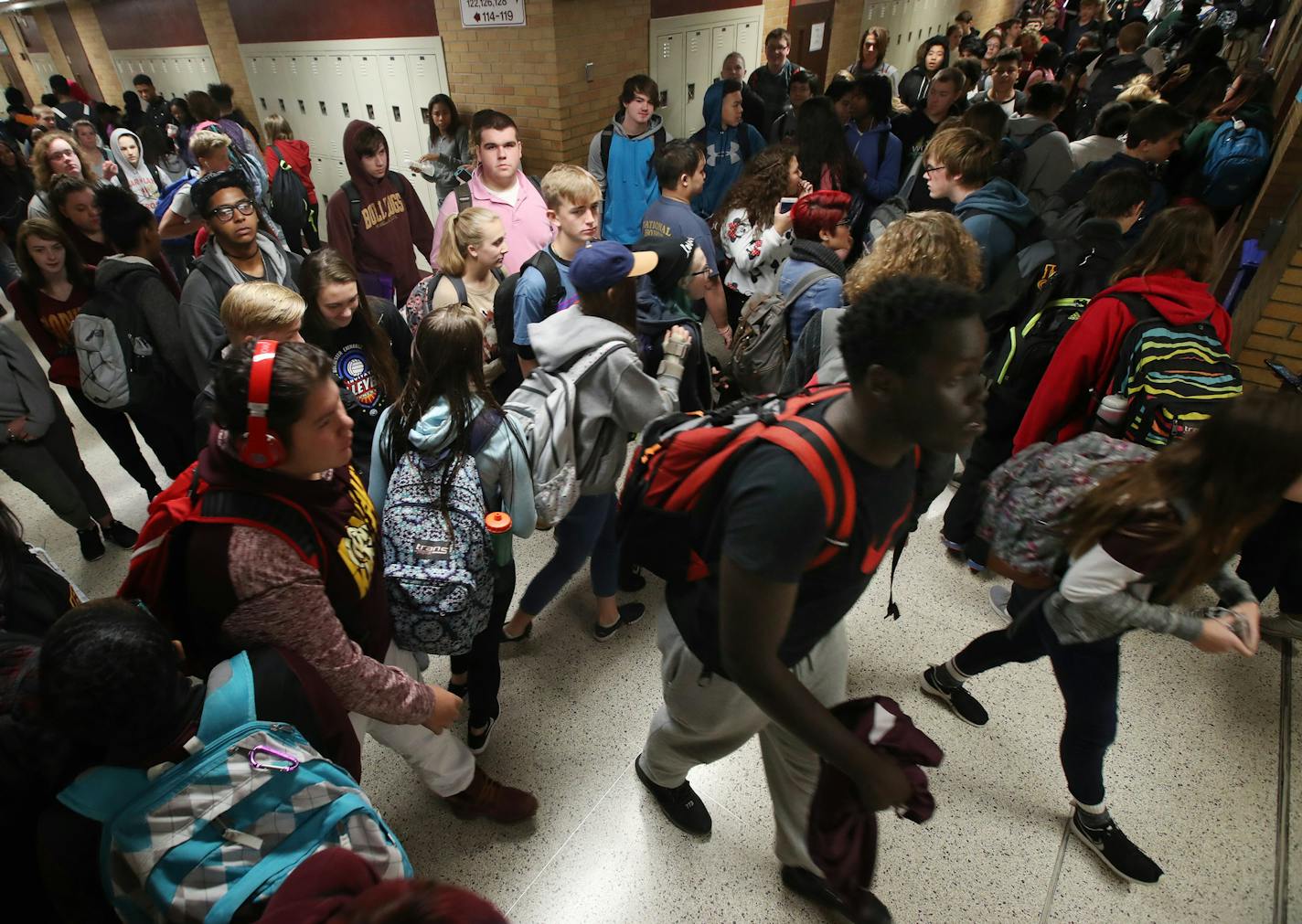 Irondale High School students walked through a section call "four corners" area during lunch hour Thursday October 26,2017 in New Brighton, MN. ]