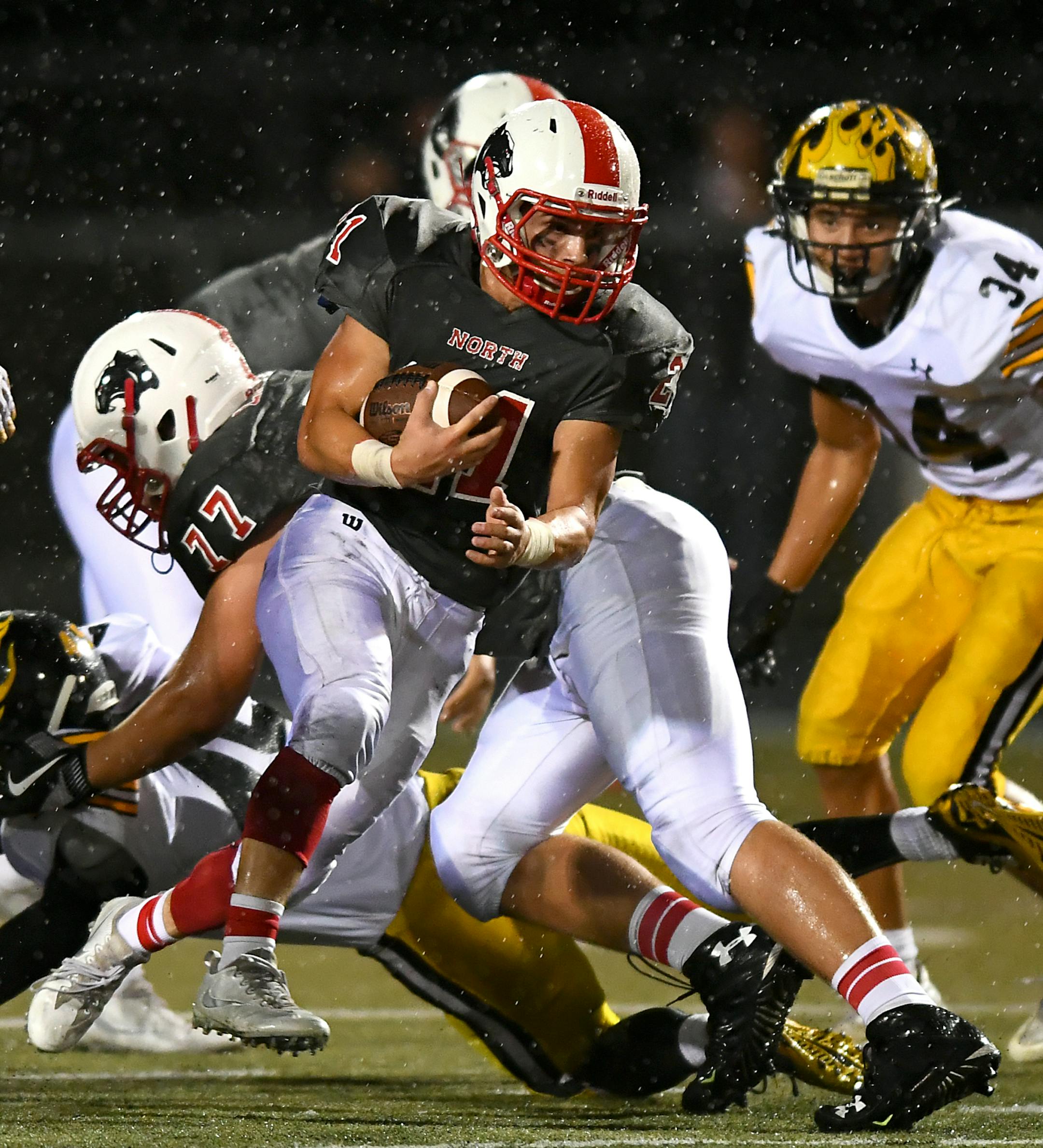 Lakeville North running back Wade Sullivan (21) rushed the ball against Burnsville in the third quarter Friday night. ] (AARON LAVINSKY/STAR TRIBUNE) aaron.lavinsky@startribune.com Lakeville North played Burnsville in a football game on Friday, Sept. 16, 2016 at Lakeville North High School.
