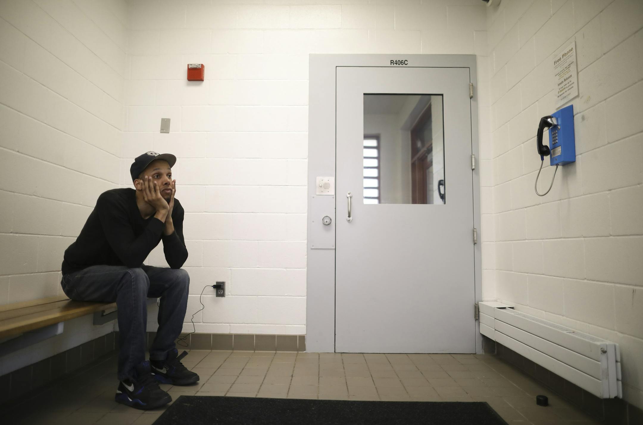 Damien Agboola waited for a cab to pick him up after being released from the Dakota County jail in 2017.