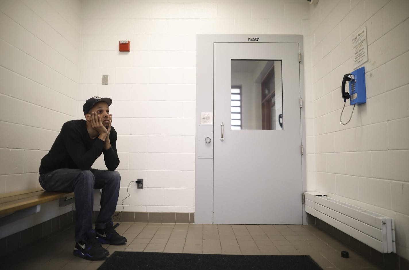 Damien Agboola waited for a cab to pick him up after being released from the Dakota County jail in 2017.