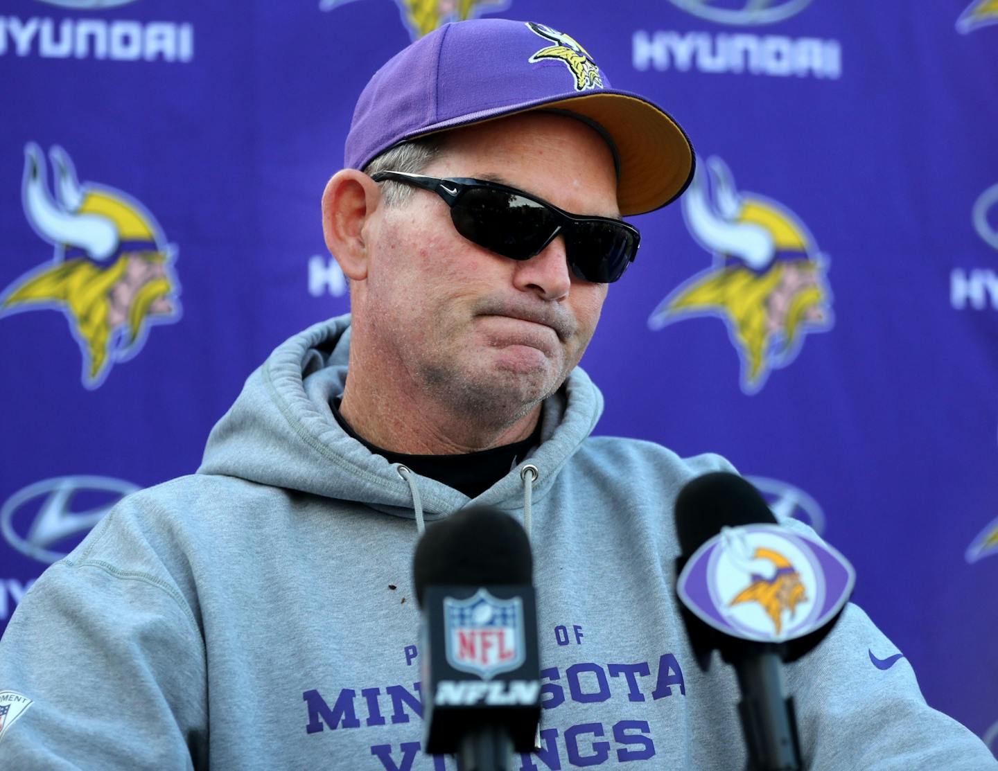 Minnesota Vikings' head coach Mike Zimmer wore sunglasses to his press conference, revealing he had undergone surgery the day before for a torn retina and that Vikings' offensive coordinator Norv Turner had resigned Wednesday, Nov. 2, 2016, at Winter Park in Eden Prairie, MN. Tight ends coach Pat Shurmur will become the interim offensive coordinator.