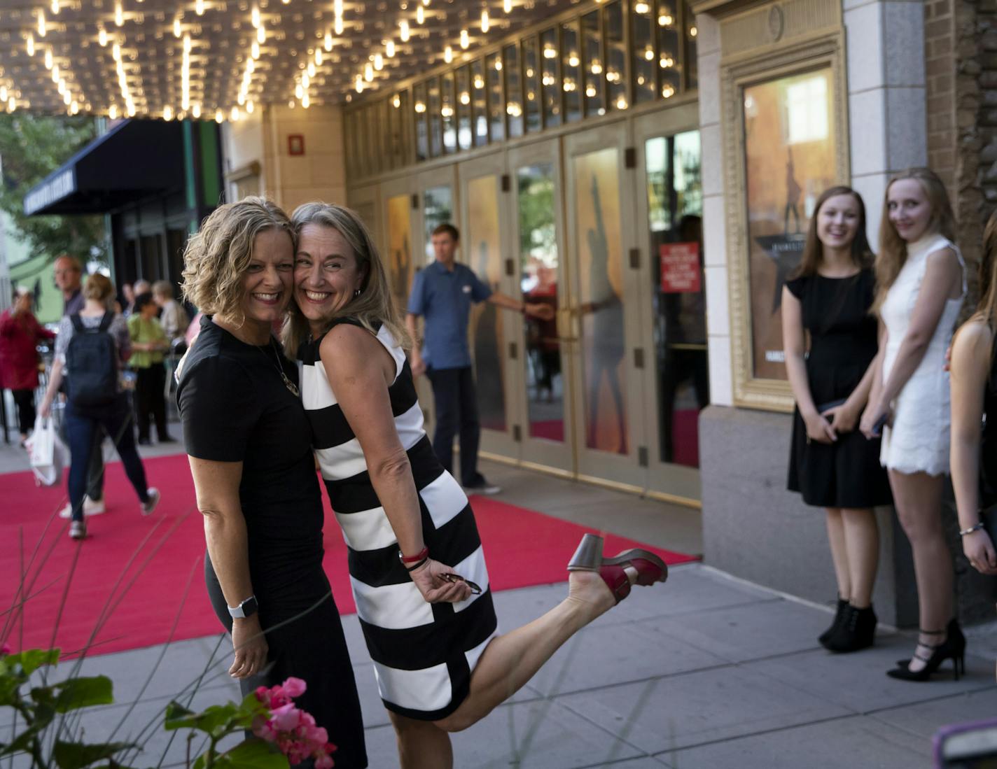 Celebrating Margie Schroeder's birthday, left, she and her sister Barb Brandt posed for a picture in front of the marquee as they arrived to see the show at opening night of Hamilton at the Orpheum Theatre in Minneapolis, Minn., on August 29, 2018. ] RENEE JONES SCHNEIDER &#x2022; renee.jones@startribune.com