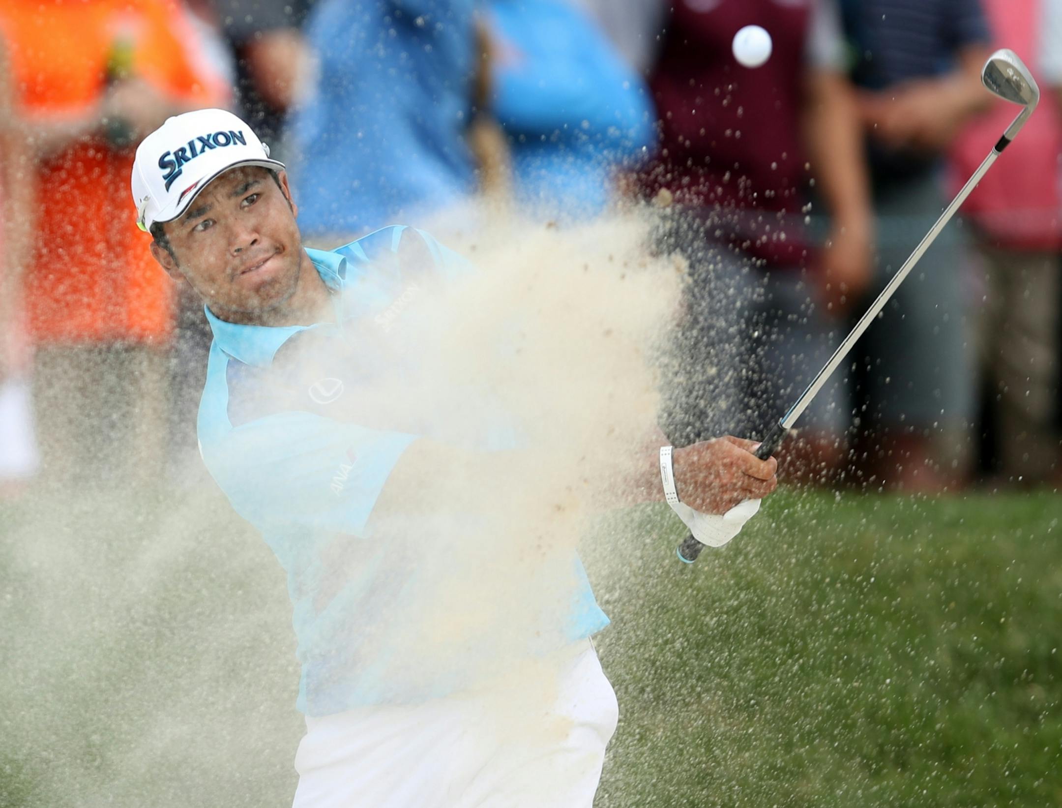 Hideki Matsuyama hits out of the bunker on the 6th hole during the final day of the 3M Open at TPC Twin Cities.