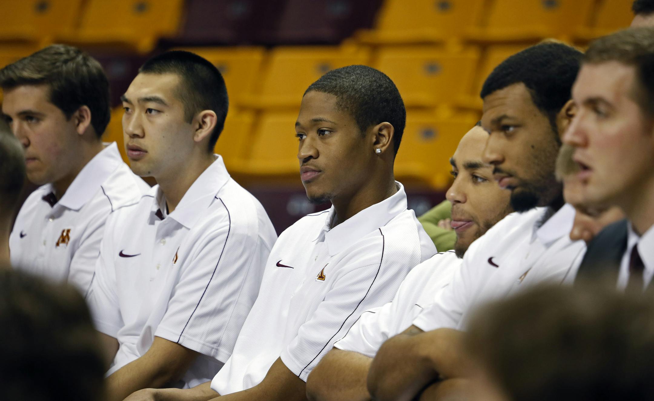 During a ceremony at Williams Arena Friday morning, Minnesota Athletic Director Norwood Teague introduced Richard Pitino, as the 17th head coach of the Golden Gophers. Here, Gopher players, including Rodney Williams (center) listen to the new coach as he answers questions at the press conference. ] BRIAN PETERSON ‚Ä¢ brianp@startribune.com Minneapolis, MN - 04/05/2013