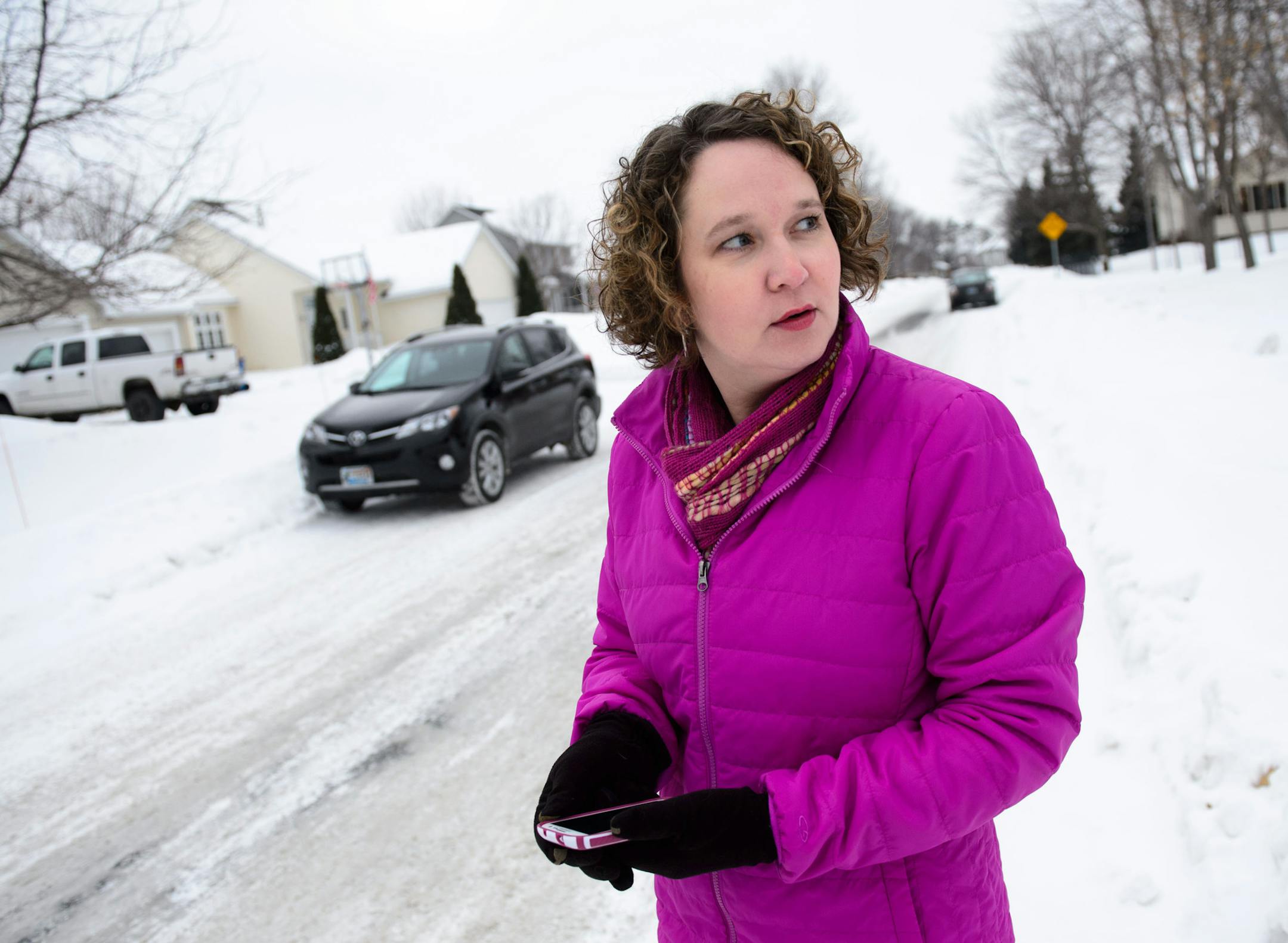 Michelle Aspelin, who with her husband, Peter, make separate trips to the bus stop each day, says she’s grateful they can track the buses.