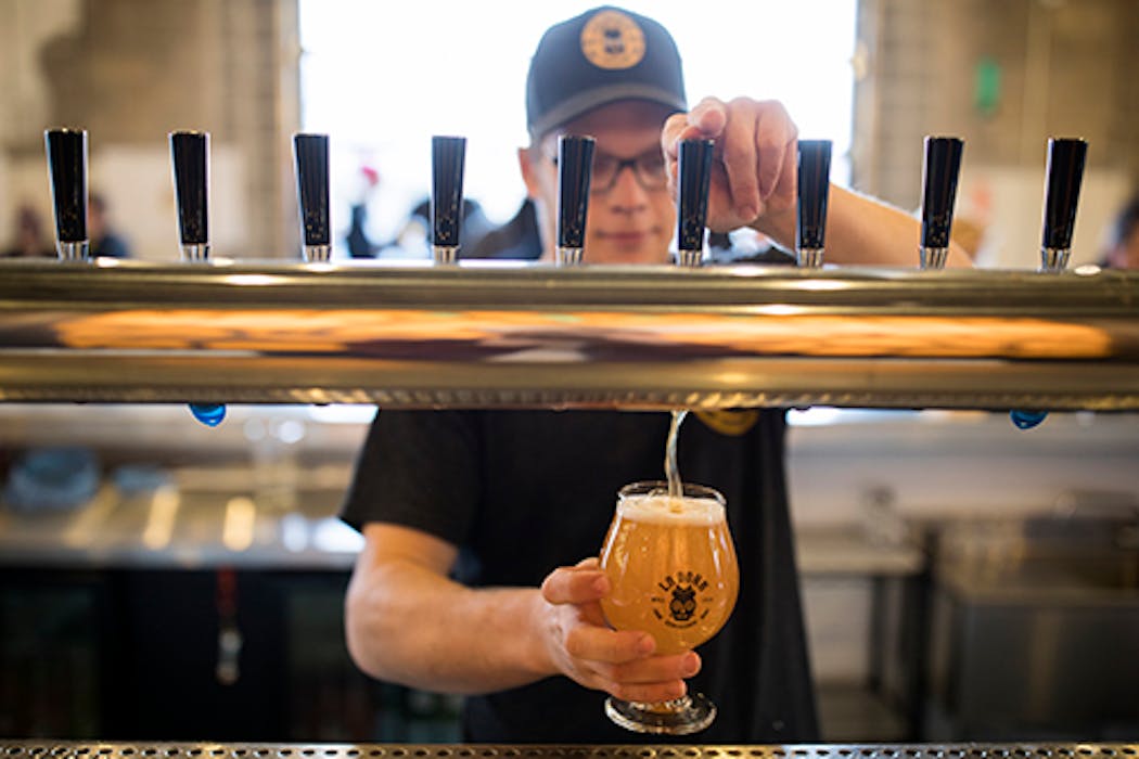 Bartender Dan Nispel poured a fresh pint at La Doña Cervecería in north Minneapolis.