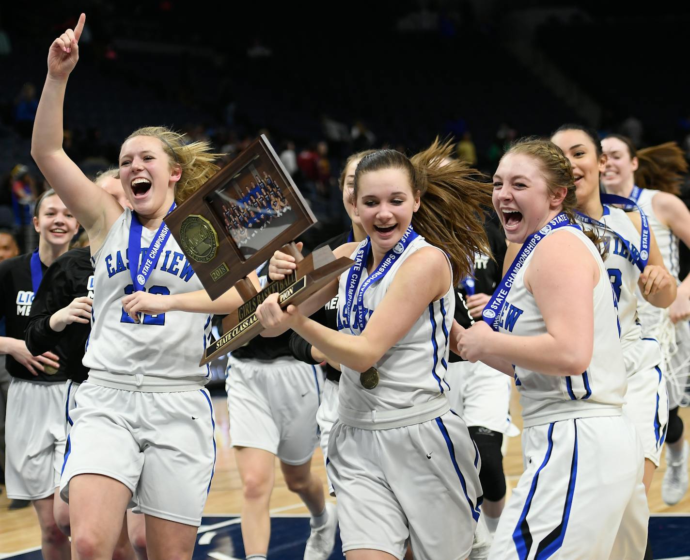 Eastview guard Emma Carpenter (4) held the team's championship trophy as she rushed toward the studnet section following their 68-63 4A championship victory over Hopkins. ] AARON LAVINSKY &#xef; aaron.lavinsky@startribune.com Hopkins played Eastview in the girls&#xed; basketball Class 4A state championship game on Saturday, March 17, 2018 at Target Center in Minneapolis, Minn