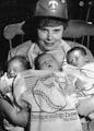 Rosemary Nally of Methodist Hospital held babies adorned with Homer Hankies on Oct. 11, 1987. From left were Karen Aderhold, Joseph Parpart and Ryan K