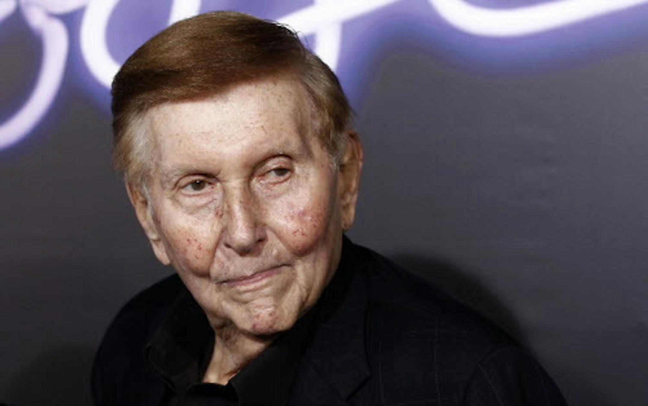 FILE - In this Oct. 3, 2011, file photo, Sumner Redstone arrives at the premiere of "Footloose" in Los Angeles. Redstone stepped down as executive chairman of Viacom on Thursday, Feb. 4, 2016, and was replaced by CEO Philippe Dauman, a move that immediately disappointed investors. (AP Photo/Matt Sayles, File)