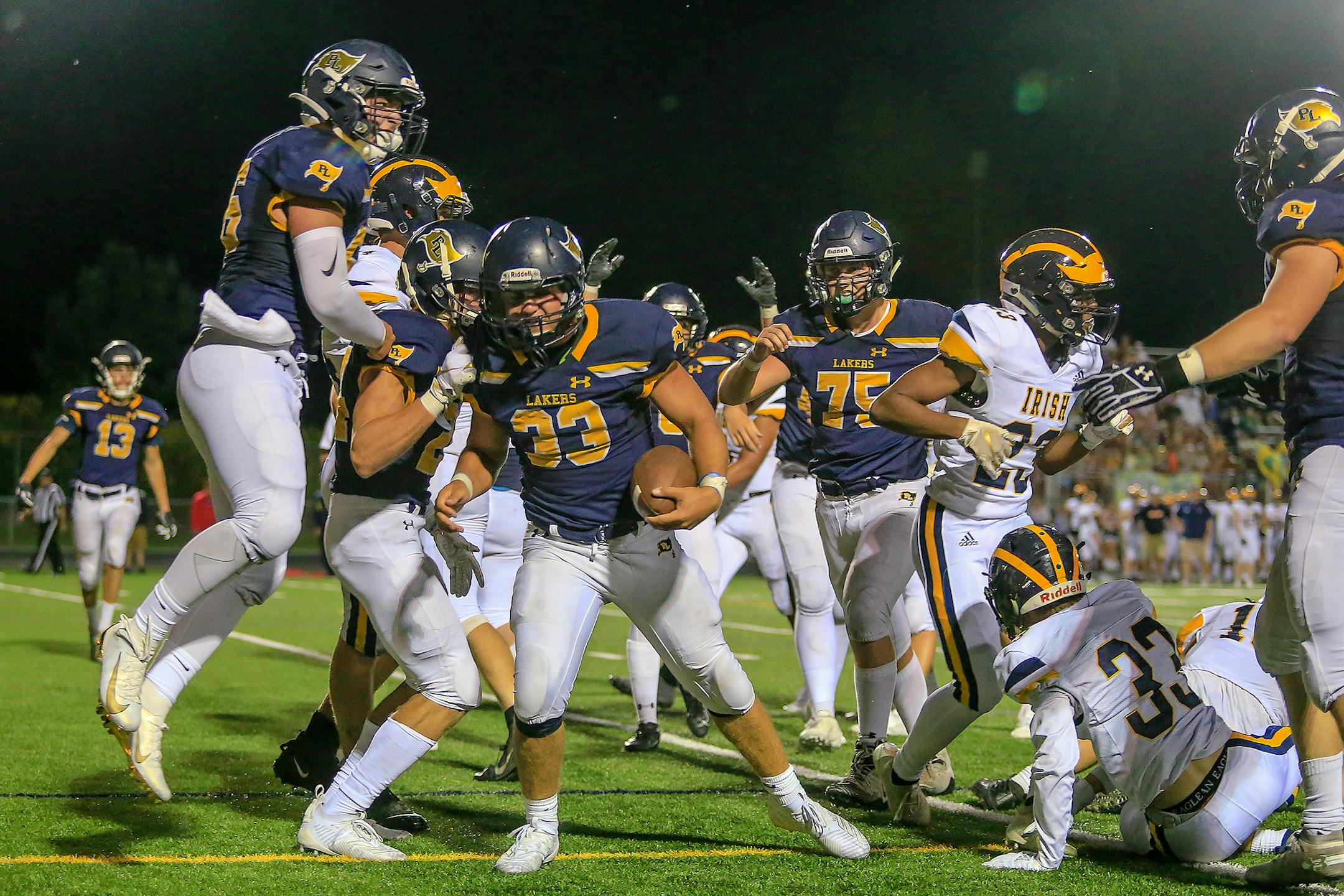 Prior Lake running back Sam Emmerich (33) celebrated his third-quarter touchdown that put the Lakers ahead 14-6. Rosemount at Prior Lake football, 8-29-19. Photo by Mark Hvidsten, SportsEngine