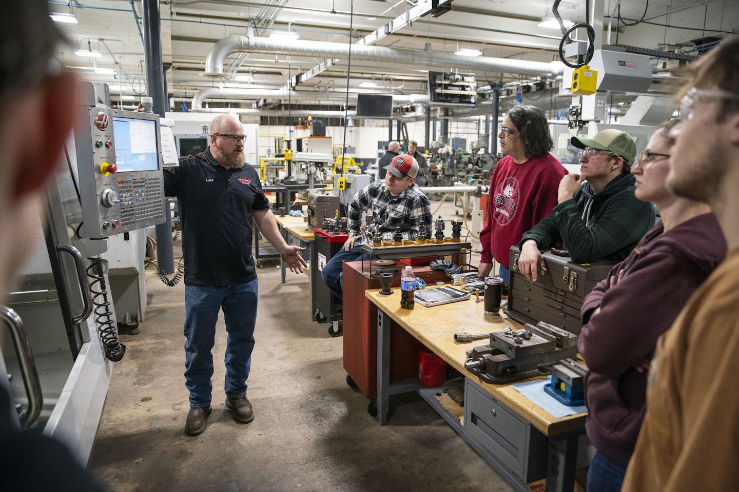 Luke Beise, a machine, tool and technology instructor, taught a CNC milling course to a small group of students in the Lake Superior College integrated manufacturing lab on Wednesday. ]
ALEX KORMANN &#x2022; alex.kormann@startribune.com Lake Superior College is looking to move it's growing advanced manufacturing training program from a leased space downtown into an expanded space on the main campus. Students were at work in the old building in class on Wednesday January 22, 2020.