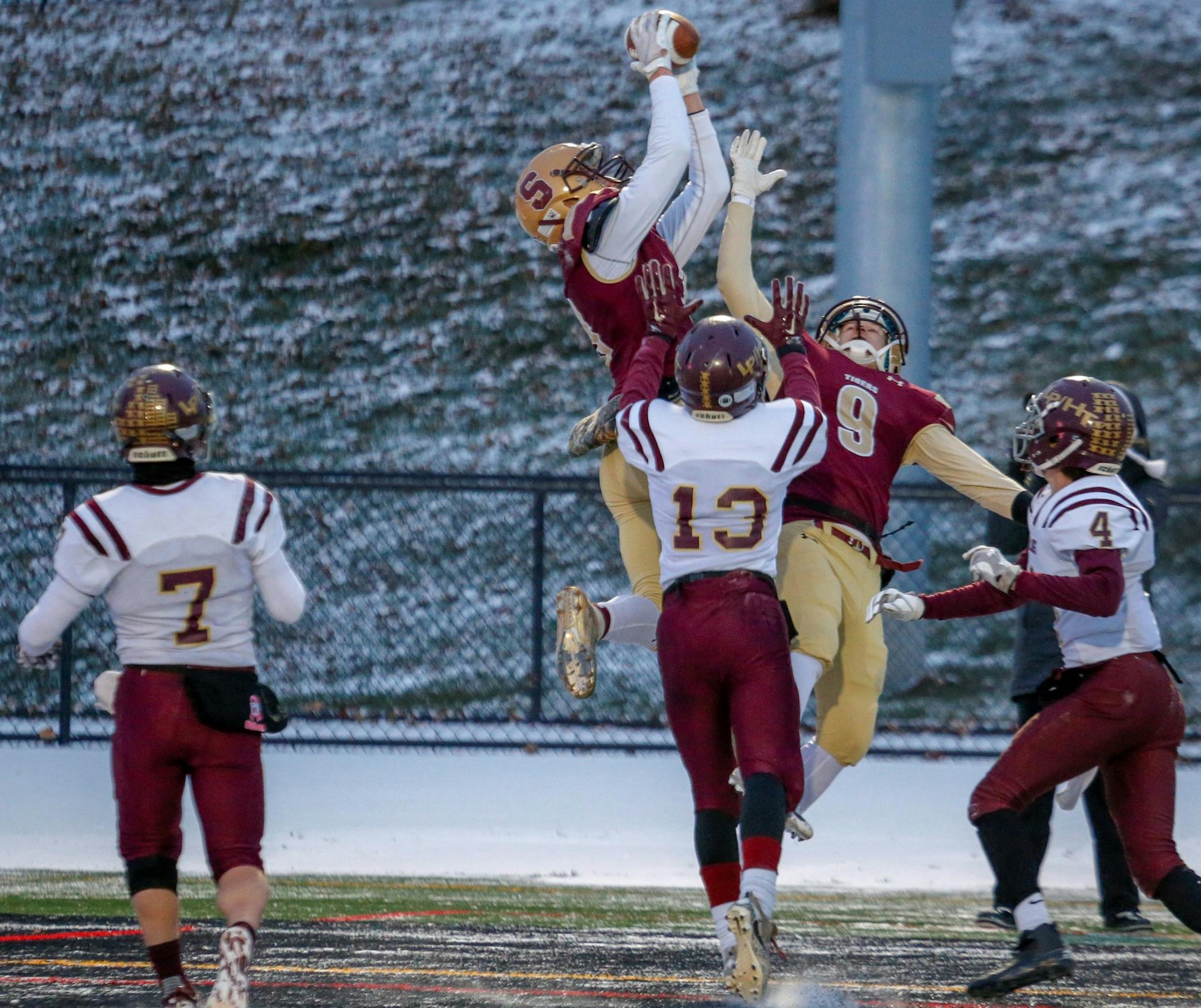 Springfield's Isaac Fink leaps to pull down a 36-yard touchdown reception against Lester Prairie/Holy Trinity. Photo by Jeff Lawler, SportsEngine