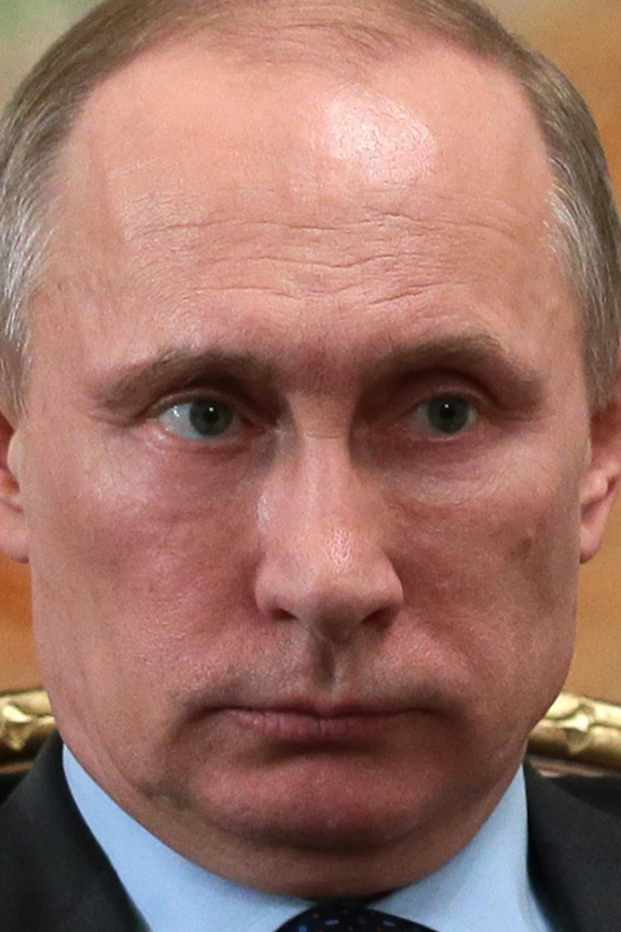 Russian President Vladimir Putin listens to Fyodor Andreyev, President of the Alrosa diamond mining company in the Novo-Ogaryovo presidential residence outside Moscow on Wednesday, Feb. 26, 2014. Putin on Wednesday ordered massive exercises involving most of its military units in western Russia amid tensions in Ukraine. (AP Photo/RIA Novosti, Mikhail Metzel, Presidential Press Service)