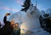 The Bartz Brothers unveiled their latest snow sculpture, a giant surprised snail, in front of their New Brighton, Minn. home this week. On Thursday, J