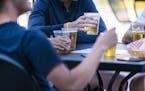 People gathered to drink on the patio of Kollege Klub in Dinkytown on June 17. It was one of four bars identified by Minnesota health officials as con