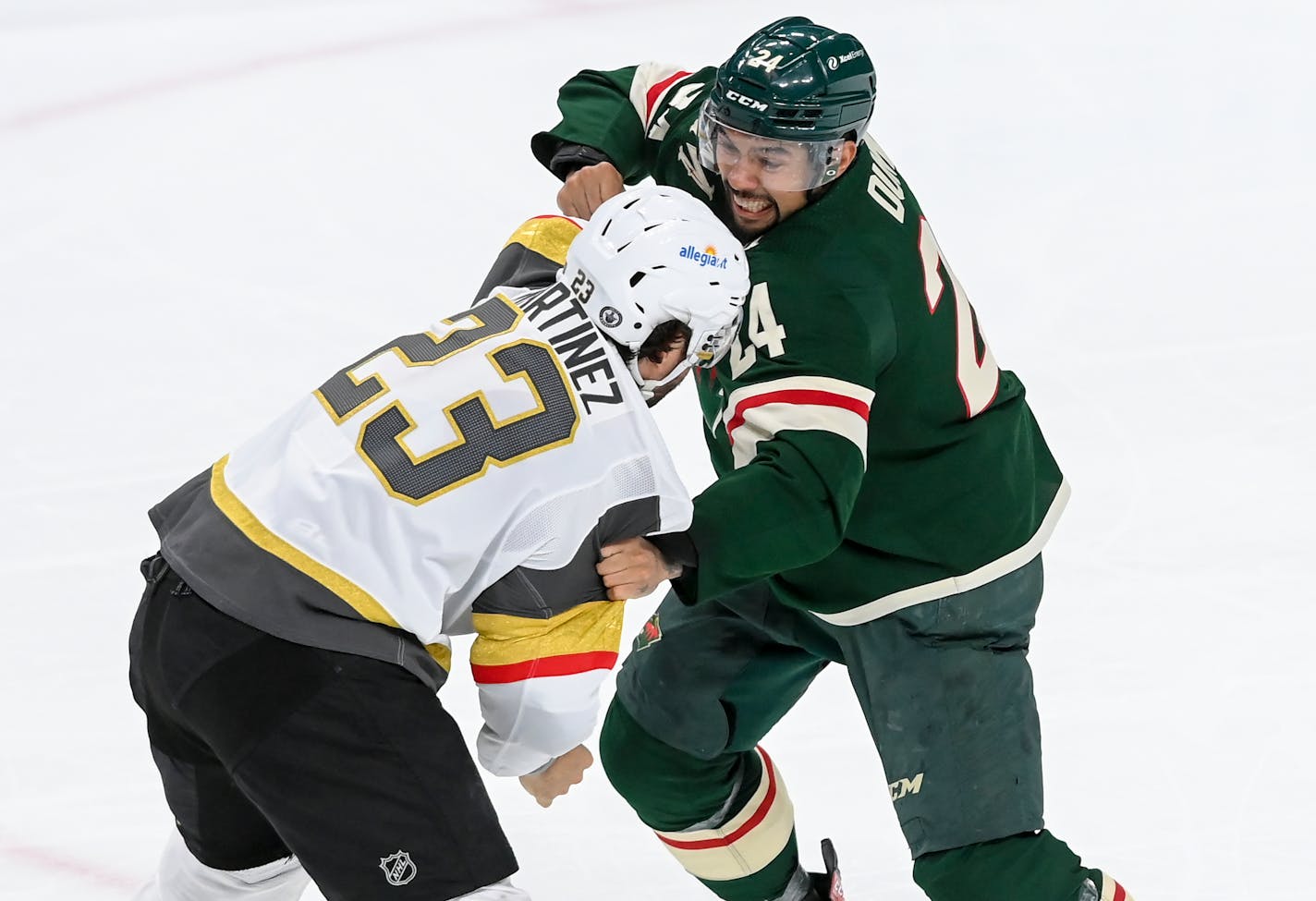 Vegas Golden Knights defenseman Alec Martinez (23) and Minnesota Wild defenseman Matt Dumba (24) fought in the second period.