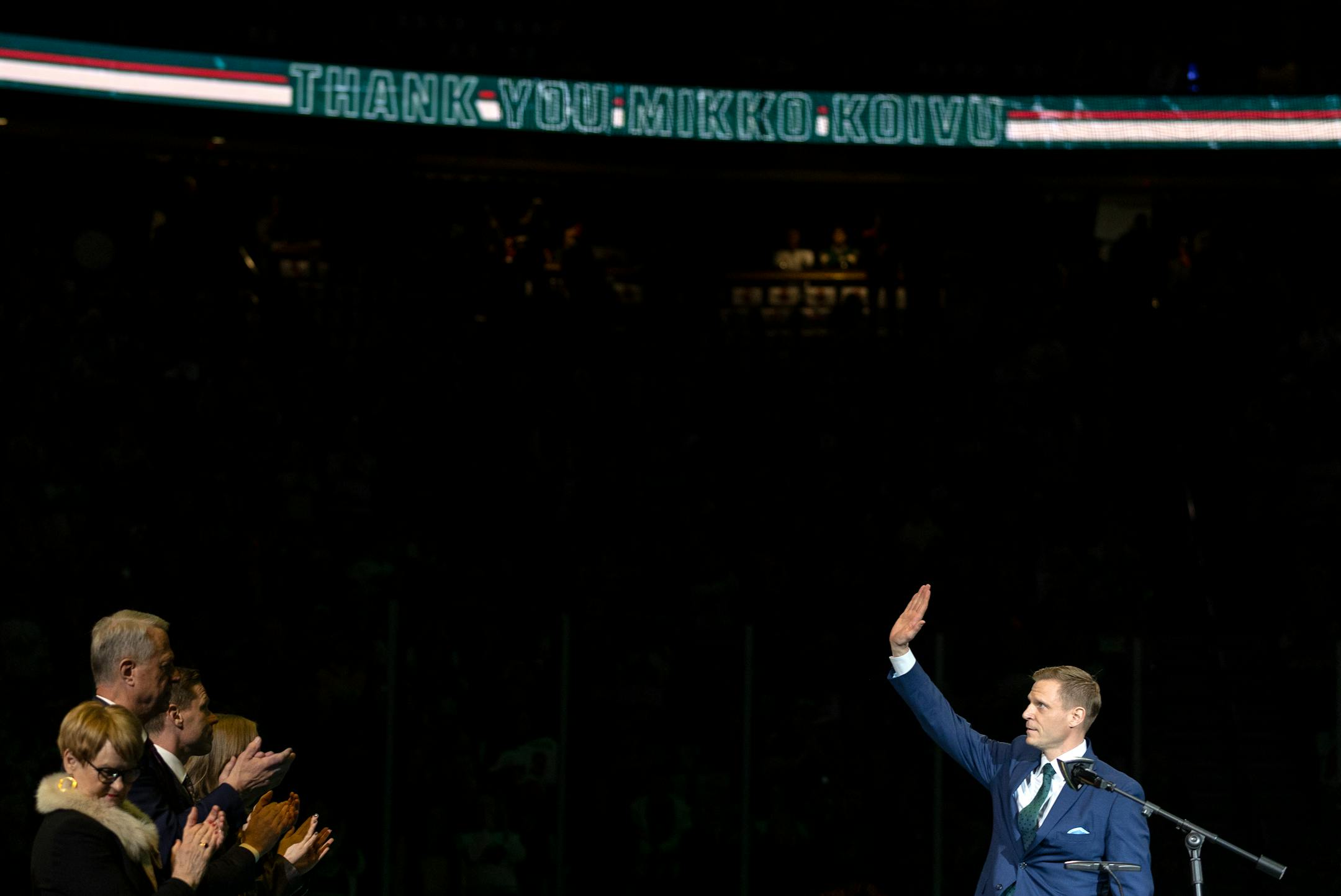 Mikko Koivu waves to the crowd during a ceremony to retire his number.