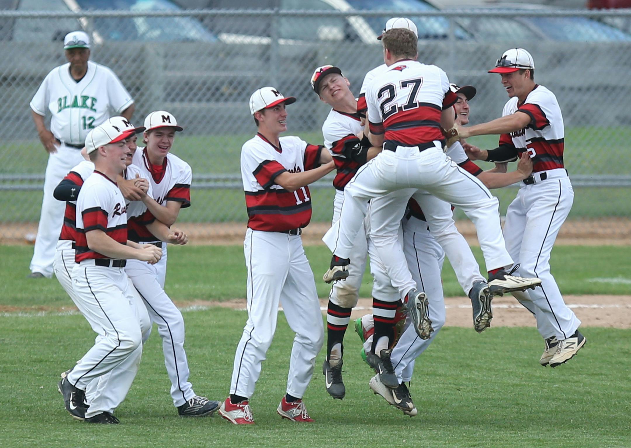 Minnehaha Academy celebrated its 5-3 section championship game win over Blake. The Redhawks begin state play Thursday vs. Providence Academy. (Kyndell Harkness, Star Tribune)