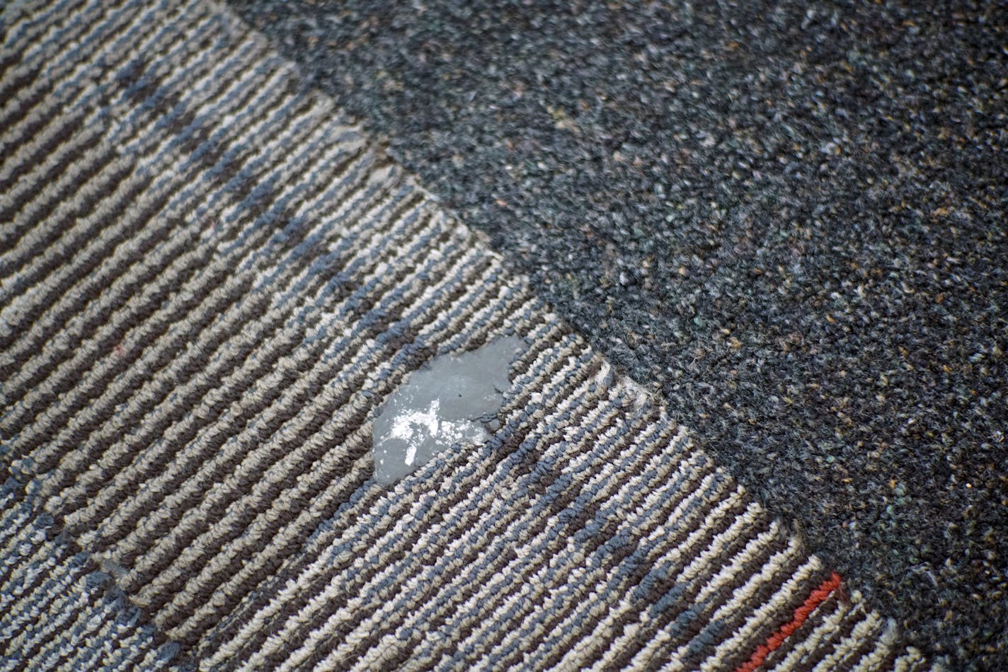 Chewing gum is a persistent enemy for airport carpet. The airport uses a beet juice concoction to clean it. Richard Tsong-Taatarii/Richard.tsong-taatarii@startribune.com