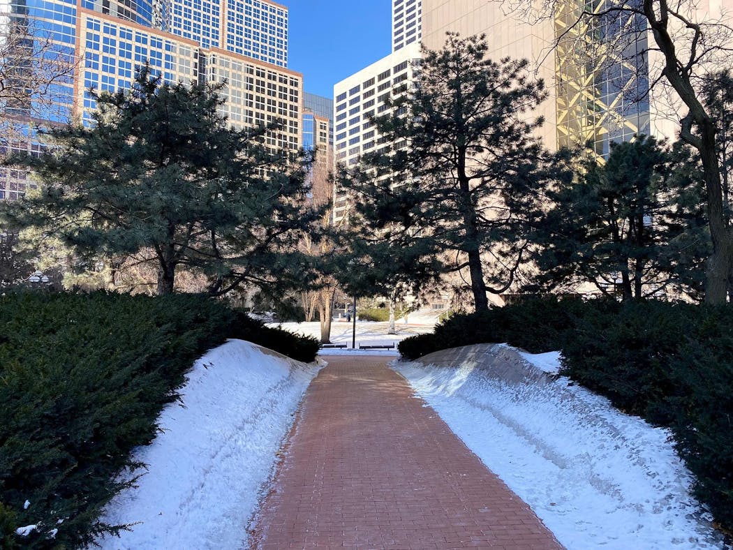 The Hennepin County Government Center south plaza is ringed by berms. Access to the plaza is restricted to five walking paths that bisect the berms. The berms act as a visual and physical barrier between sidewalk and plaza.
