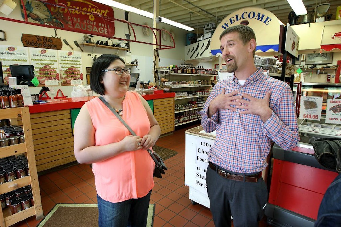 After receiving proton beam therapy at Mayo Clinic, patient Ashley Sullivan greeted and thanked Evan Timm of "Ye Old Butcher" shop, Monday, June 22, 2015 in Rochester, MN. Ye Old Butcher donated meat that was used to research the device that was used to treat Sullivan's brain tumor.