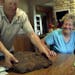 Bruce and Nelva Lilienthal with the 30 plus pound meteor Bruce found about two years ago while plowing a field and seen Wednesday, June 19, 2013, at t