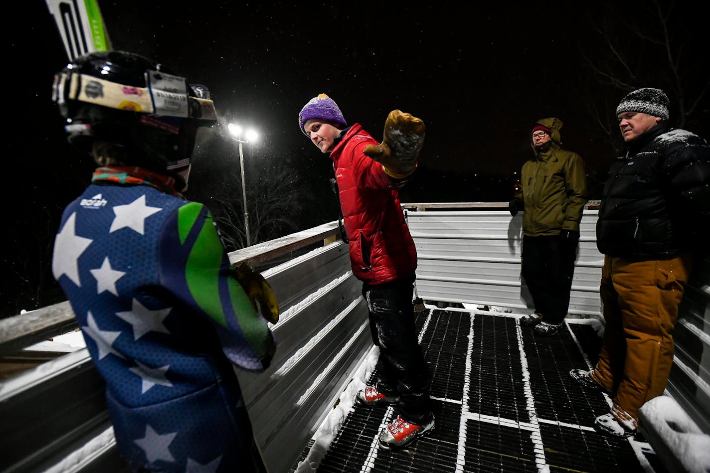 Minneapolis Ski Jumping Club coach Nick Johnson gave some feedback to Finn Cherveny, 13, of Minneapolis, after one of his jumps Tuesday night at Hyland Lake Park Reserve.