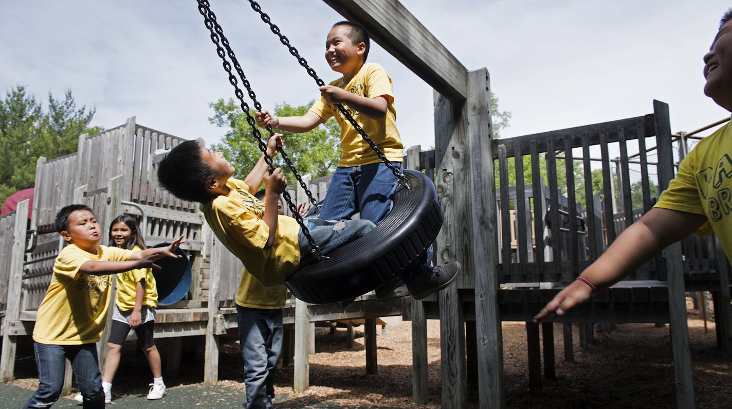 Park Brook 3rd graders Drake Thammavongsa, left, and Aaron Vu are pushed on the tire swing by Elvin Yang, far left, and other elementary students during a recess trip to French Regional Park on Wednesday. ] isaac.hale@startribune.com A push to desegregate major regional Twin Cities parks and trails has created a rise in diversity among children at parks. During the afternoon of Wednesday, June 8, 2016, 3rd-grade students from Park Brook Elementary took to the French Regional Park in Plymouth, MN