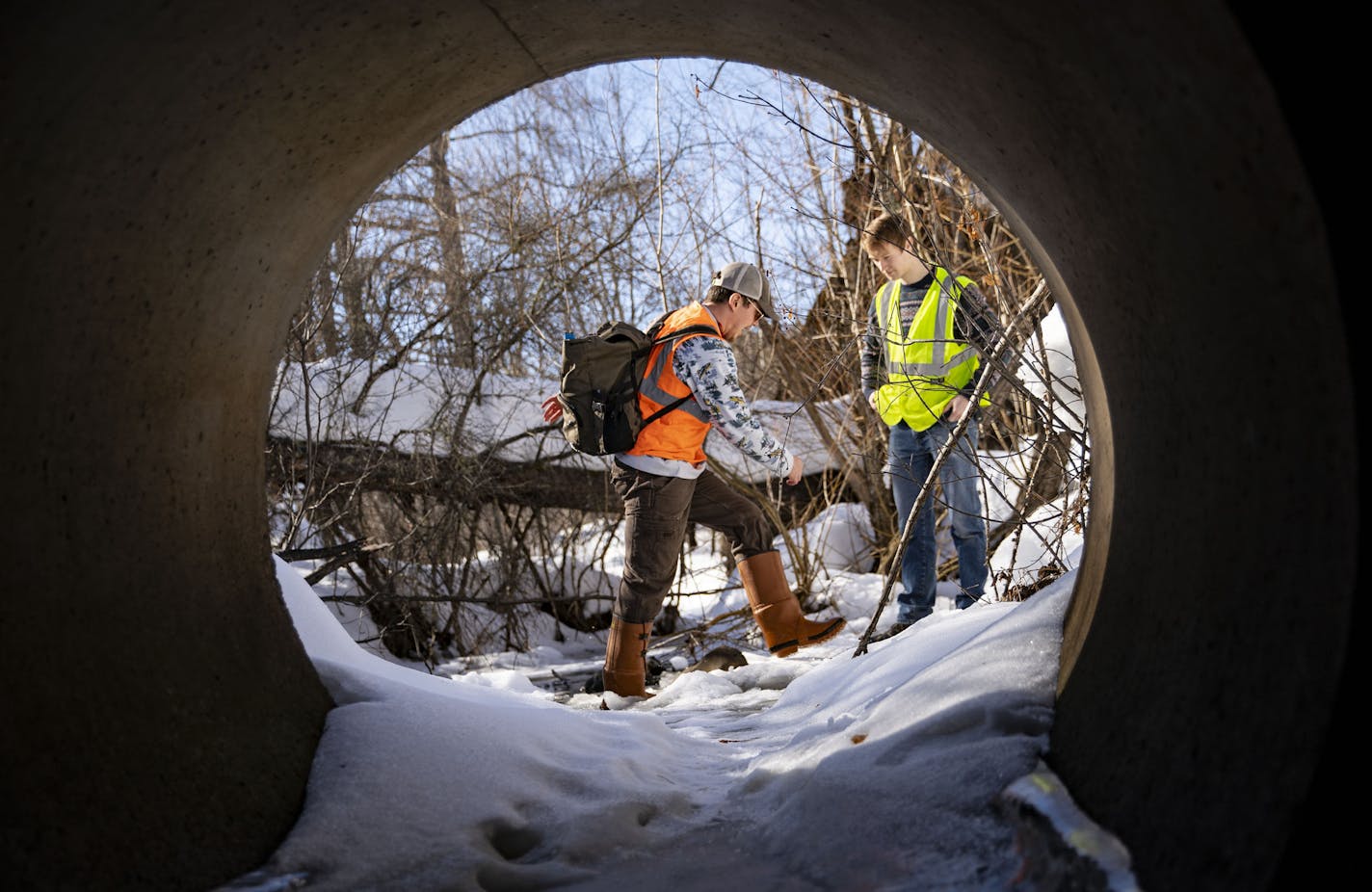 (Left) Max Brubaker, a University of Minnesota Duluth research scientist, walked out of Tischer Creek in the Hatley Nature Center with his undergraduate assistant, Collin Krochalk, after collecting water samples on Monday. ]
ALEX KORMANN &#x2022; alex.kormann@startribune.com University of Minnesota Duluth researchers are partnering with the DOT and DNR to look at chemicals that could be more environmentally friendly and effective than salt when treating winter roads. Researchers went out testing