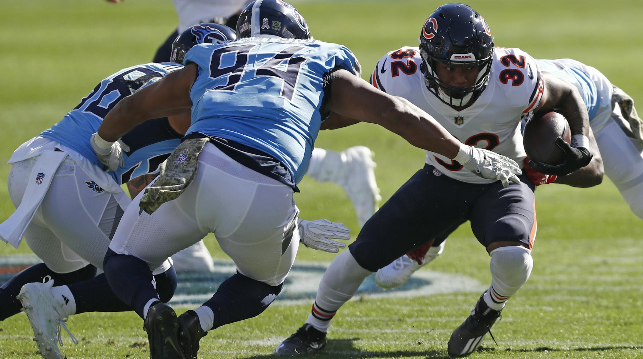 Chicago Bears running back David Montgomery (32) carries the ball against Tennessee Titans defensive tackle Jack Crawford (94) in the first half of an NFL football game Sunday, Nov. 8, 2020, in Nashville, Tenn. (AP Photo/Wade Payne)