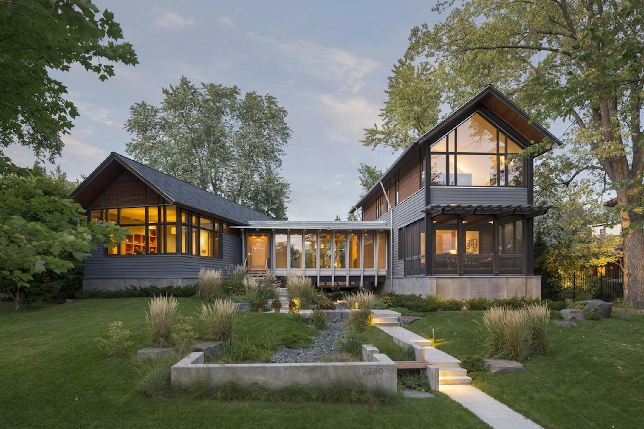 A glass bridge connects the two wings of a home near Lake of the Isles in Minneapolis, designed by David O'Brien Wagner, SALA Architects.