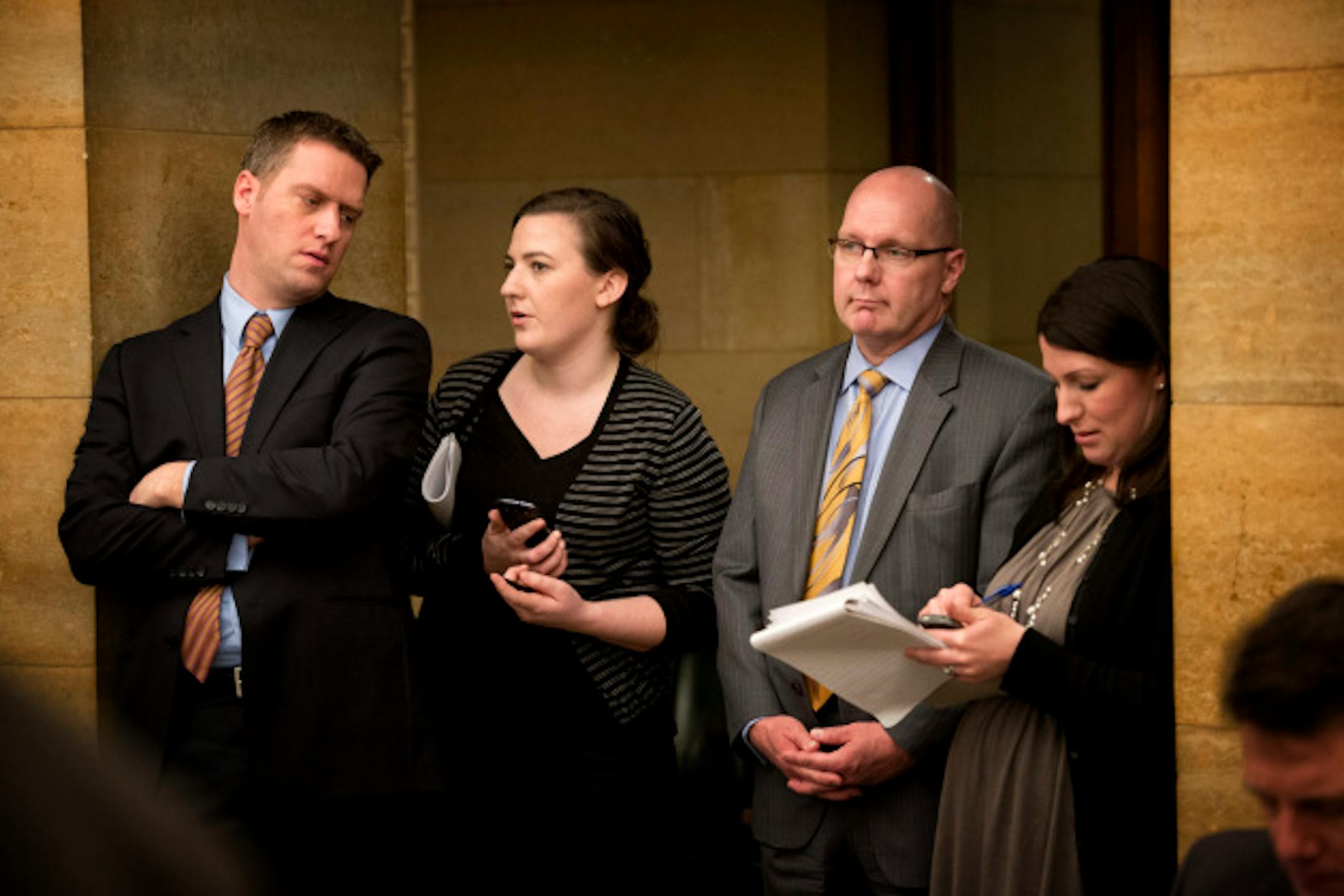 House minority leader Kurt Daudt and Assistant minority leader Sen. David Thompson talked with GOP staffers Susan Closmore and Leslie Rosedahl as they listened in the back of the room while DFL leaders   spoke to reporters about the State of Minnesota February Budget Forecast on Thursday, February 28, 2013.    ]   GLEN STUBBE * gstubbe@startribune.com  EDS:  legislators are L to R and staffers are l to r.