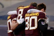 Gophers quarterback Athan Kaliakmanis (8) was helped to the locker room after taking a hit to the legs in the second quarter of Thursday’s Pinstripe