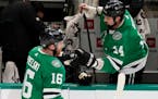 Dallas Stars center Joe Pavelski (16) celebrates his goal with teammate Jamie Benn (14) during the first period of an NHL hockey game against the Chic
