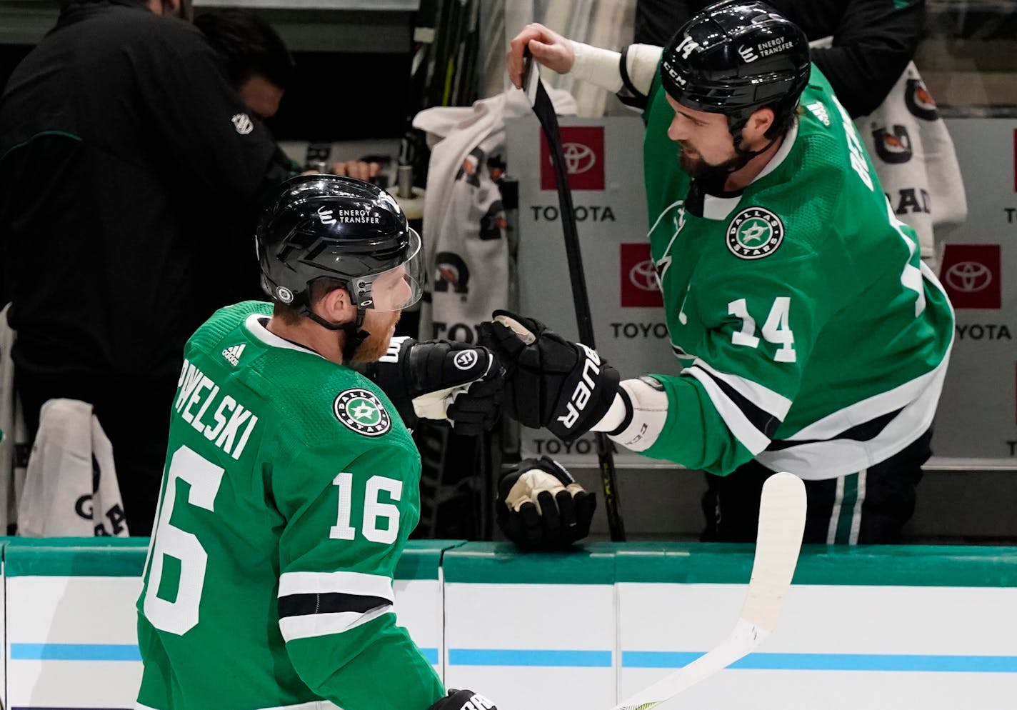 Dallas Stars center Joe Pavelski (16) celebrates his goal with teammate Jamie Benn (14) during the first period of an NHL hockey game against the Chicago Blackhawks in Dallas, Saturday, Dec. 18, 2021. (AP Photo/LM Otero)