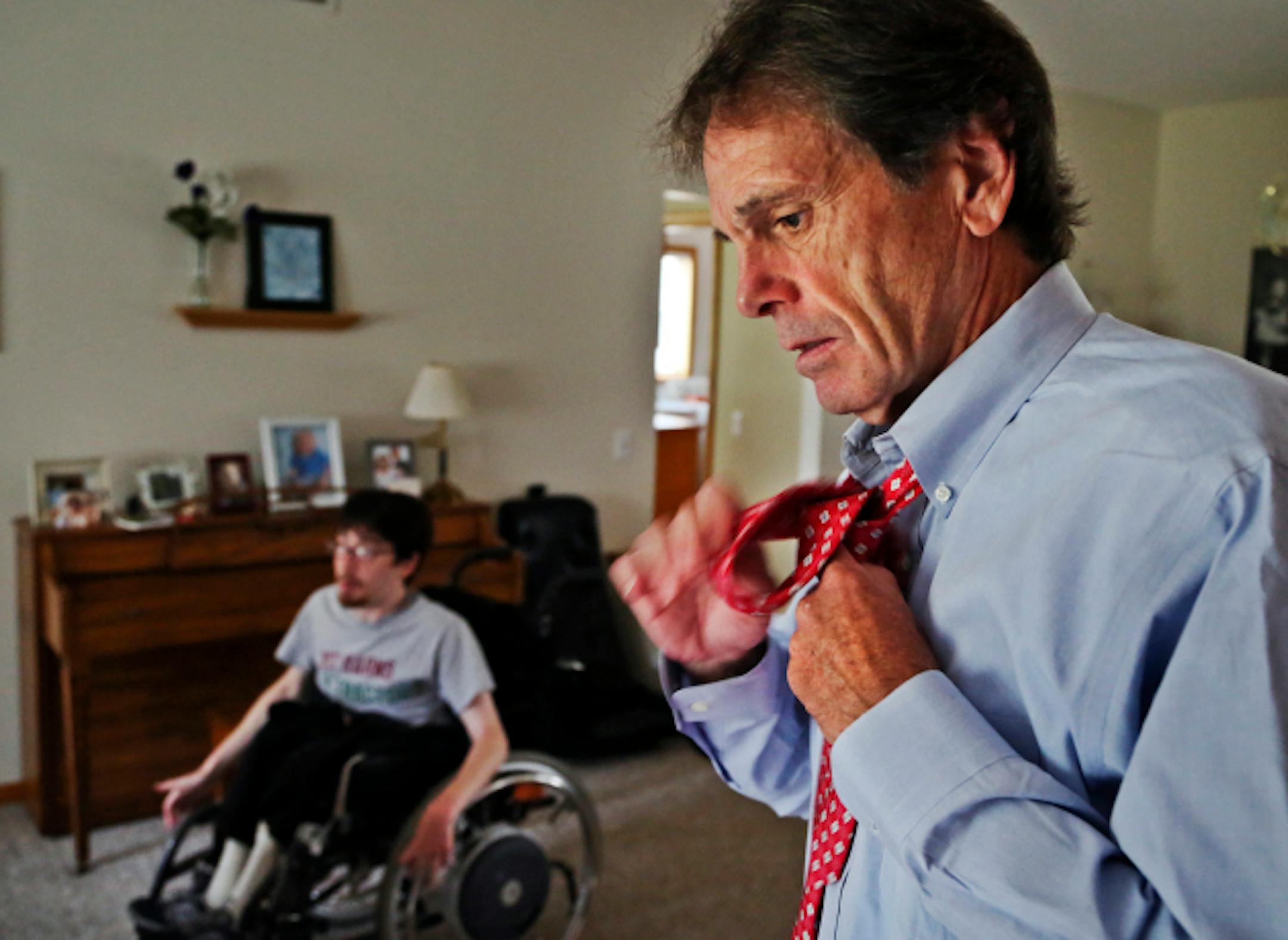 Here, Mike Duffy, 62, ties his necktie near his son Ryan, before heading off to a job interview for a sales job in the north metro Friday, Sept. 27, 2013, at his home in Eden Prairie,MN. He wasn't offered the job. Duffy, 62, lost his sales job in 2007, and after six years of intermittent employment, dozens of fruitless job interviews and quiet self-assessments on drives back home, he learned that at the age of 62 in a sluggish job market, his job candidacy has lost its shine. "It's kind of like the baseball player who hits his late 30s and realizes he's just not wanted anymore," Duffy said. Duffy, however, is not big on self pity and hasn't dropped out. He was recently hired part-time by Starbucks at $7.75 an hour, sometimes arising at 3:30 to go to work. What he earns in a half day he once earned in a half-hour during the peak of his sales career. On the bright side, a Starbucks manager recently told Duffy this: "Starbucks is lucky to have you," she said. "Your connection to the customer is fantastic and age doesn't matter."](DAVID JOLES/STARTRIBUNE) djoles@startribune.com People over 50 who lost their jobs during the recession have taken a permanent hit, many of them whisked into an unemployed/retired limbo. They can't find a good job and they haven't saved enough. They sell life insurance and do odd jobs and a little freelance work here and there. More than 52,000 people in Minnesota have been unemployed for more than six months, and those who lost jobs and were rehired elsewhere lost earning power across the demographic spectrum, especially in comparison to those who kept their jobs.