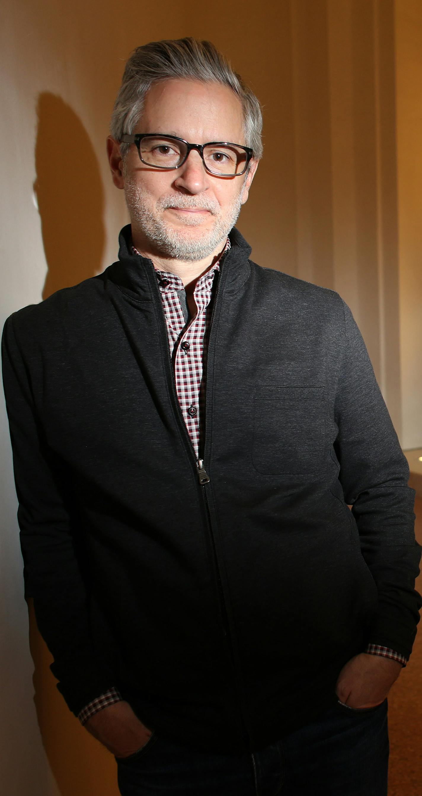 Tim Carl, the architect behind the new renovation of Northrop Auditorium, stood in one of the stairwells where they taken the urns from the main theater space and refurbished them for this location. ] (KYNDELL HARKNESS/STAR TRIBUNE) kyndell.harkness@startribune.com At the Northrop Auditorium in Minneapolis Min., Friday, December 12, 2014