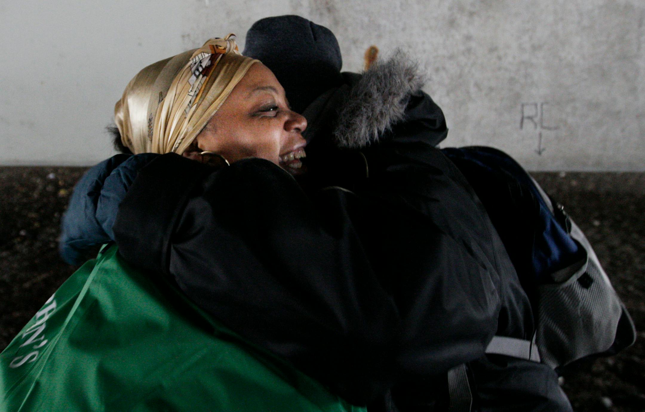 Under the 394 overpass, outreach worker Chiffon Williams hugged Goggleeye as they said goodbye. She thanked her for the winter gloves.
