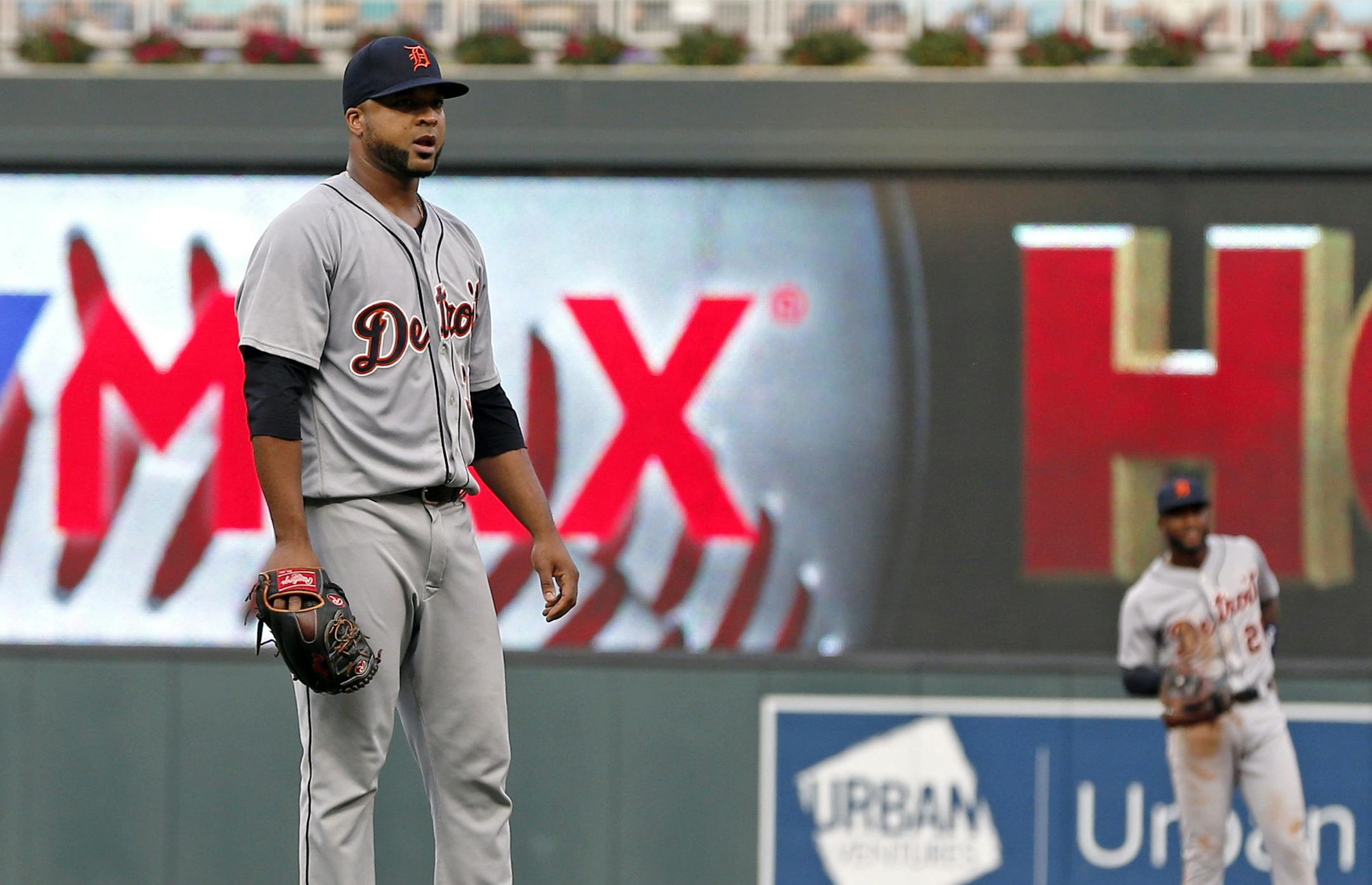 Detroit Tigers pitcher Francisco Liriano, left, watches Minnesota Twins scoring on a three-run home run by Jorge Polanco during the first inning of a baseball game Thursday, Aug. 16, 2018, in Minneapolis. (AP Photo/Jim Mone)
