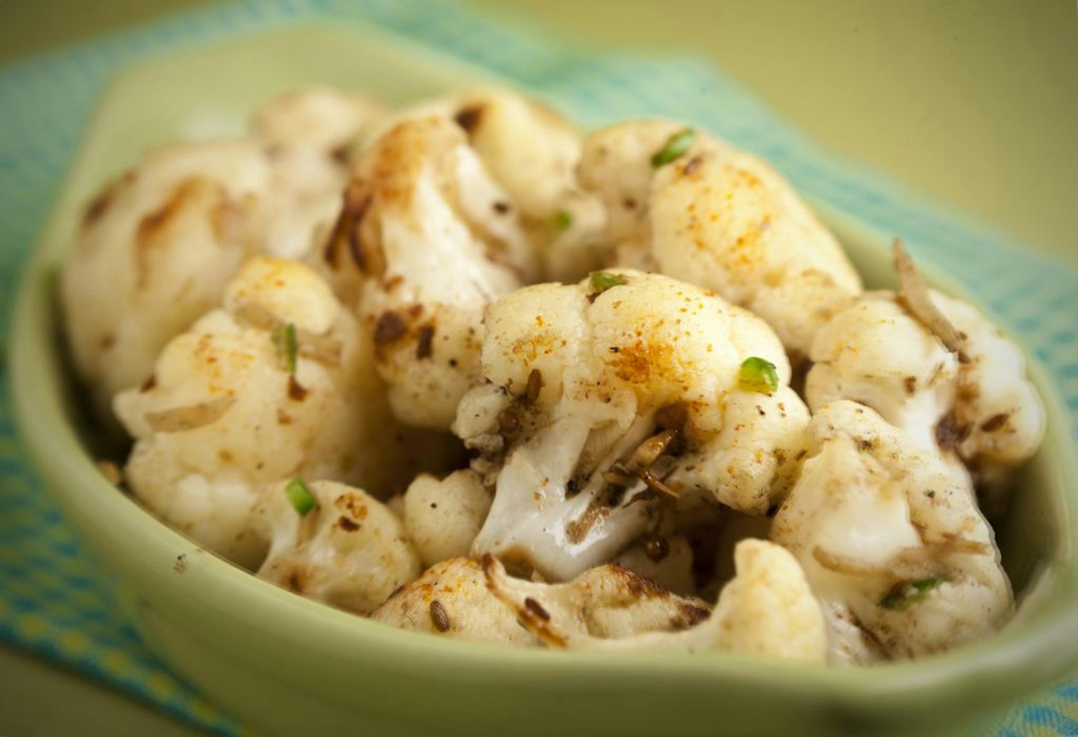 Top chefs offer a few helpful tips on developing flavor in the sometimes disrespected vegetable, the cauliflower. Here, cauliflower with ginger, garlic and green chilies.