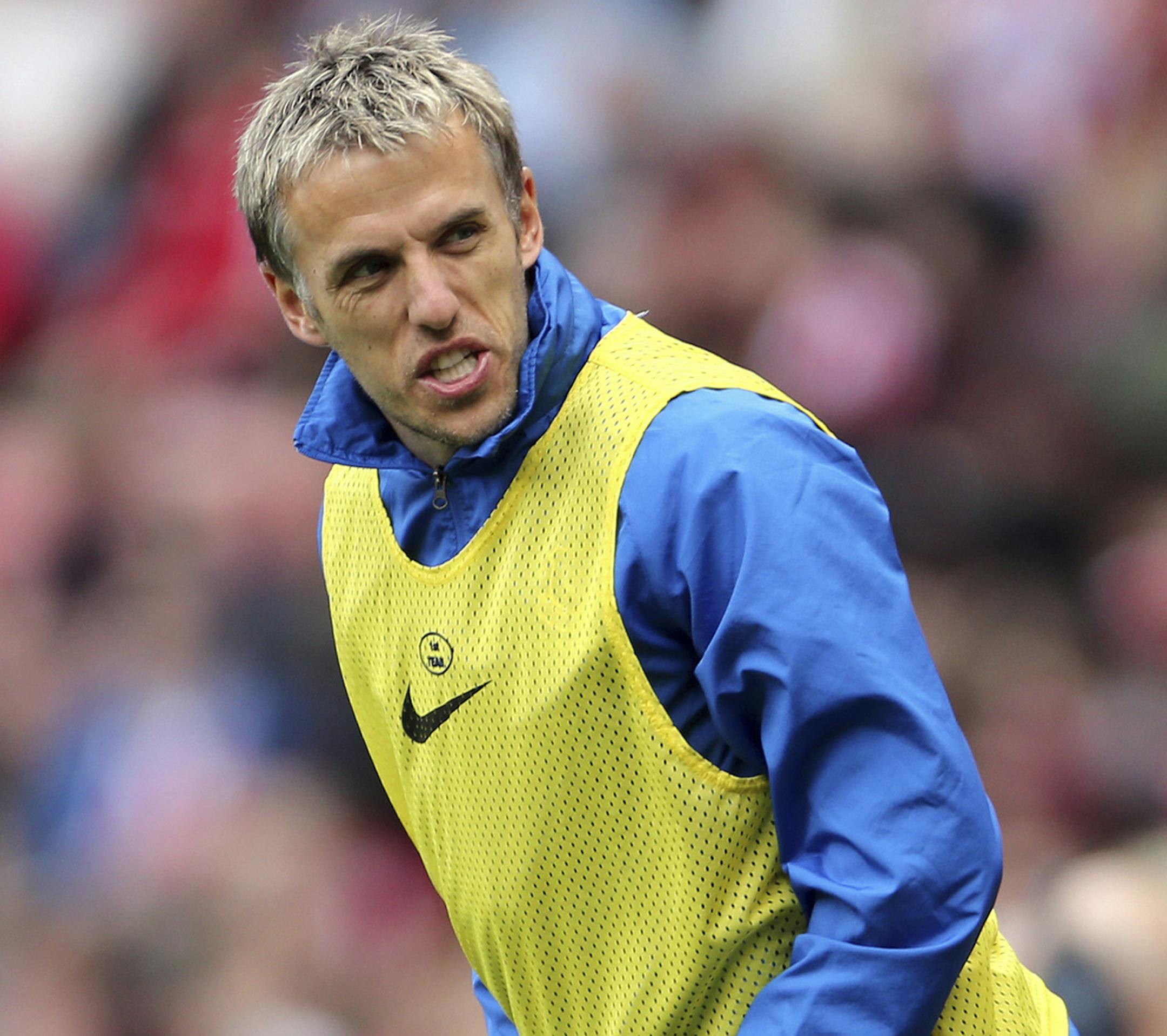 FILE - A Saturday, April 20, 2013 file photo showing Everton's Phil Neville, during their English Premier League soccer match against Sunderland at the Stadium of Light, Sunderland, England. Phil Neville has been hired as manager of Englandís womenís team. Since retiring from playing in 2013, Neville has had brief spells as an assistant coach with the England Under-21 menís team, United and Valencia. He has also managed Salford City _ the semi-professional team he co-owns with oth