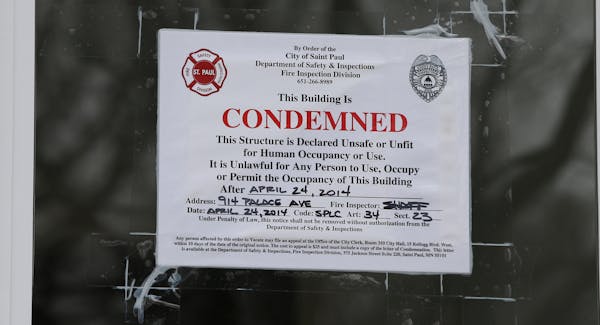Sign on the front door of a drug house at 914 Palace Avenue in St. Paul, photographed on 5/2/14. The hit men boarded a plane in Los Angeles on April 1
