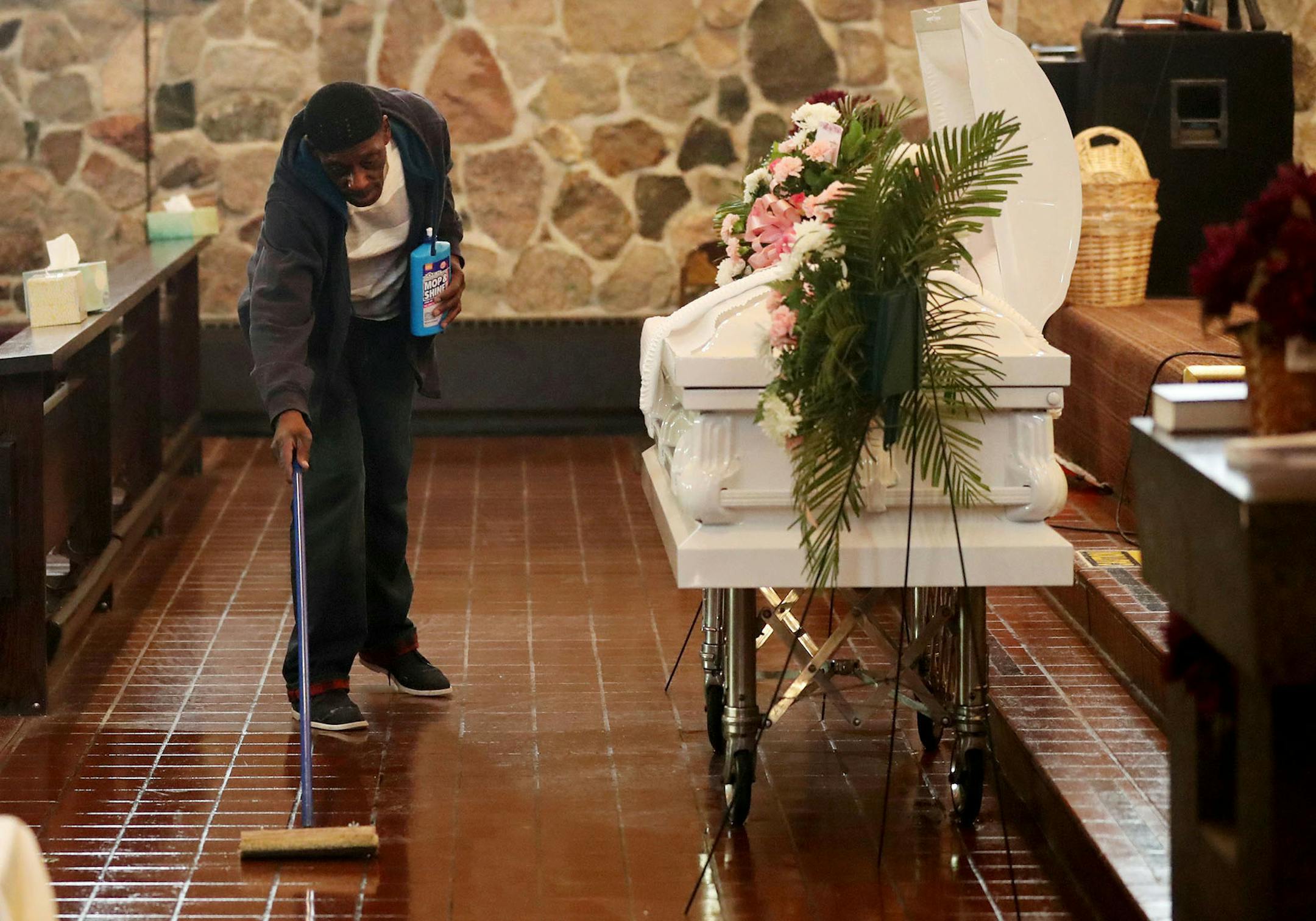 Two years after his release from prison following a 23-year stint in seven federal penitentiaries on weapons and drug-related charges, Sharif Willis, 67, is back in Minneapolis. Willis admits to having lived the life of a gang member and now believes his life must be about penance and education. “If I spend the rest of my life making up for what I’ve done, it isn’t enough,” he says. Here, Willis cleaned the church floor prior to a funeral Friday, March 1, 2019, at New