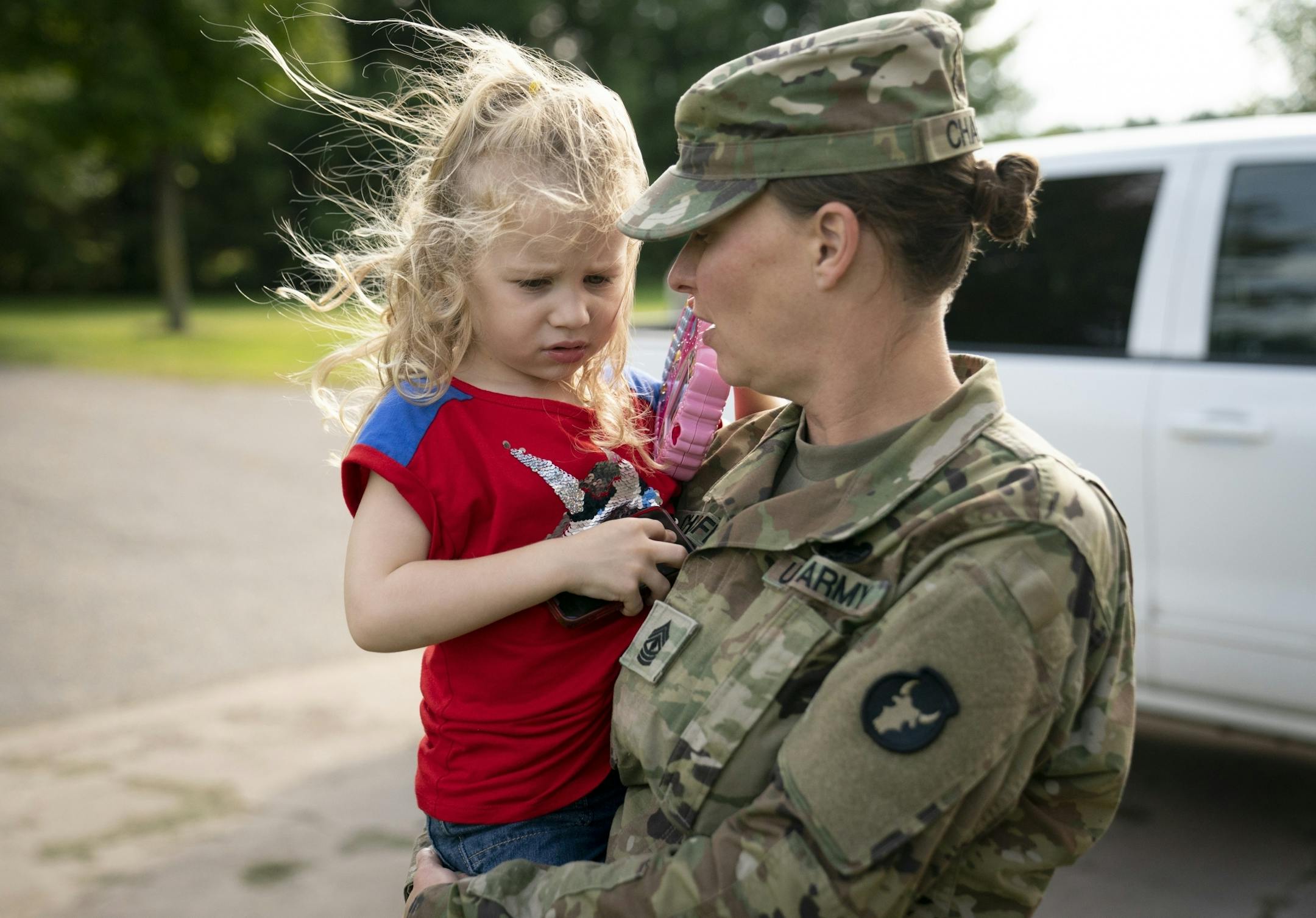 Jeanette Chafee held her daughter Ally, 3, at home in Scandia, Minn., on Wednesday, September 18, 2019. Chafee was in her uniform after coming home from work.