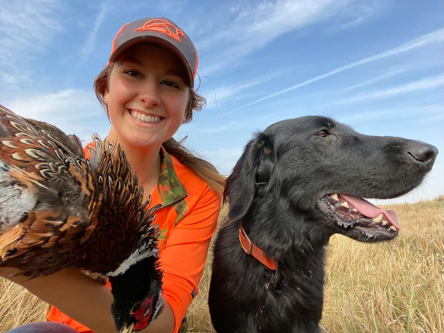 Emy Marier, 33, the membership and annual giving manager at Pheasants Forever, grew up in Hugo in a hunting family. A self-proclaimed “dog nerd,” she loves the working relationships she has with her flat coated retriever (Lux, shown here) and Labrador retriever. ] Provided by Emy Marier