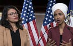 FILE - In this July 15, 2019, file photo, U.S. Rep. Ilhan Omar, D-Minn, right, speaks, as U.S. Rep. Rashida Tlaib, D-Mich. listens, during a news conf