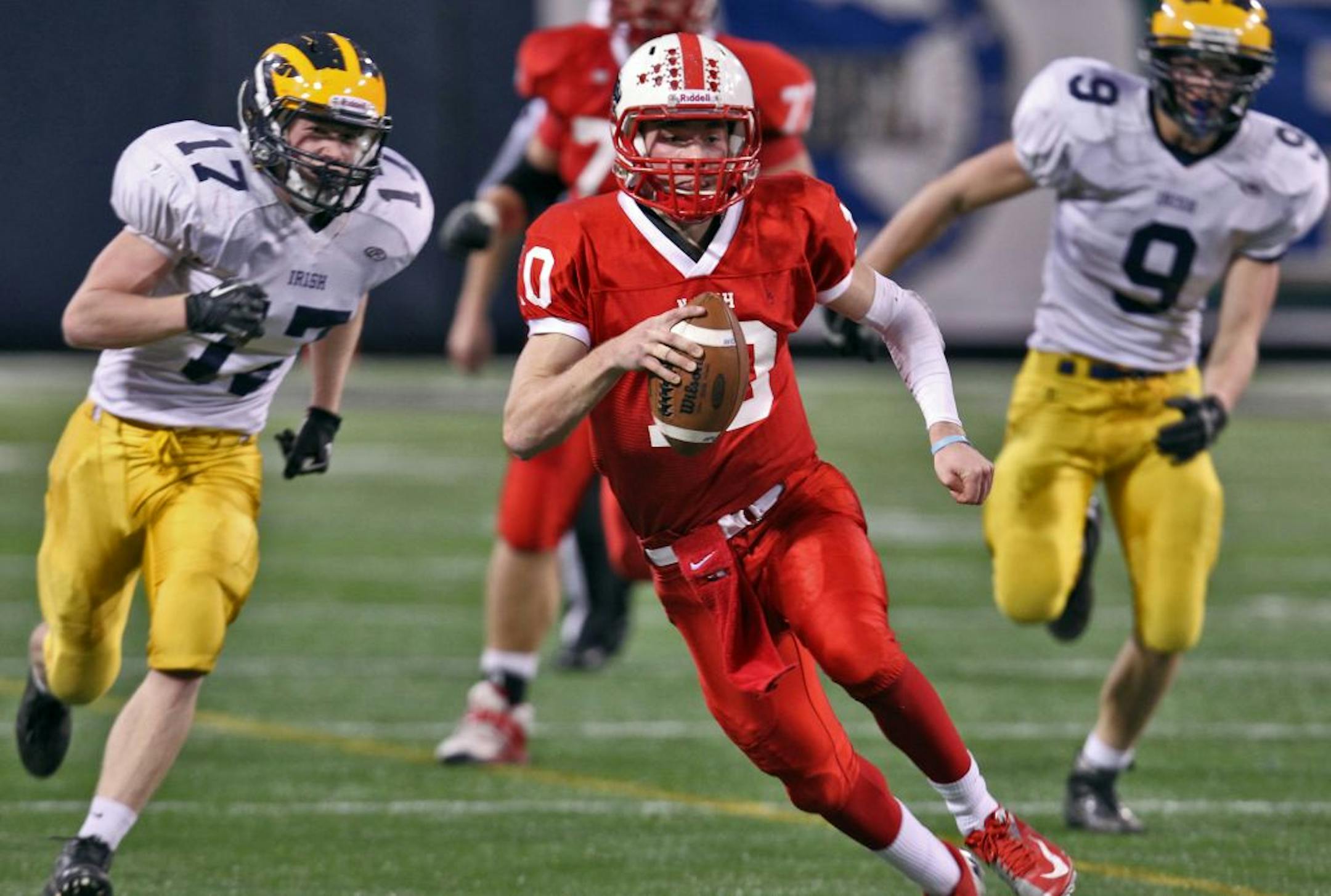 Lakeville North quarterback Zach Creighton left Rosemount tacklers behind on a quarterback keeper.