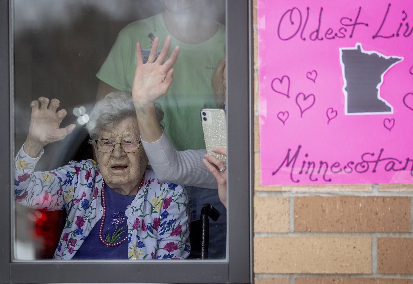 Friends an family celebrated the 112th birthday of Erna Zahn with a parade in front of her window at the Oak Hills Living Center, Tuesday, April 14, 2020 in New Ulm, MN. Erna Zahn is Minnesota's oldest resident. ] ELIZABETH FLORES &#x2022; liz.flores@startribune.com